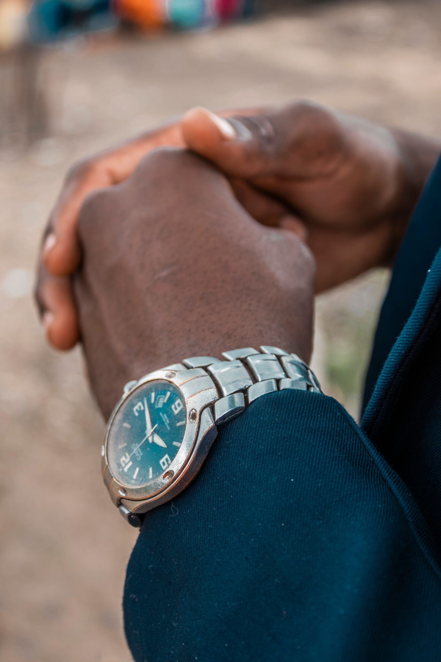 A close-up shot of an African man's hand wearing a stylish wristwatch in Nairobi, Kenya.